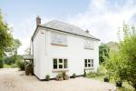 Evolution Storm Windows have been installed in this property in cream, against the rendered walls this gives the property a fresh and bright look